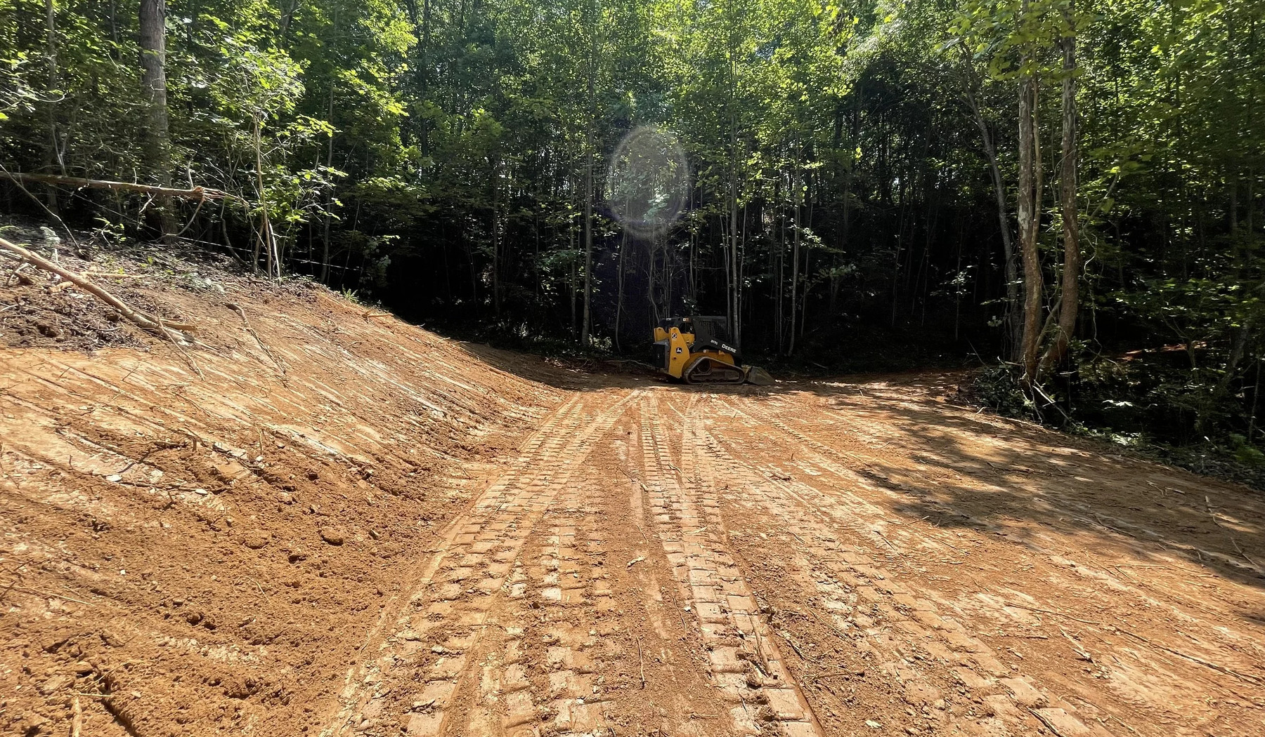 Access road and wooded path clearing with equipment in Chatsworth Georgia